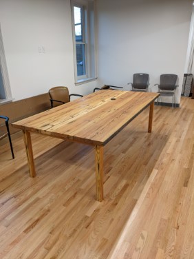 angled view of finished and assembled table in office
